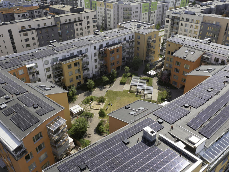 Modern apartment buildings with solar panels on the roof